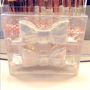 Iridescent bow ceramic candle holders.